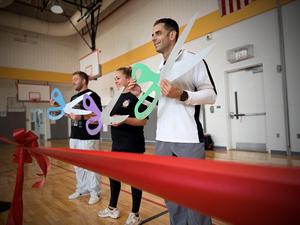 Gym teachers gather for the ribbon cutting