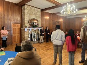 Rylen and Zach speaking to the assembled group.