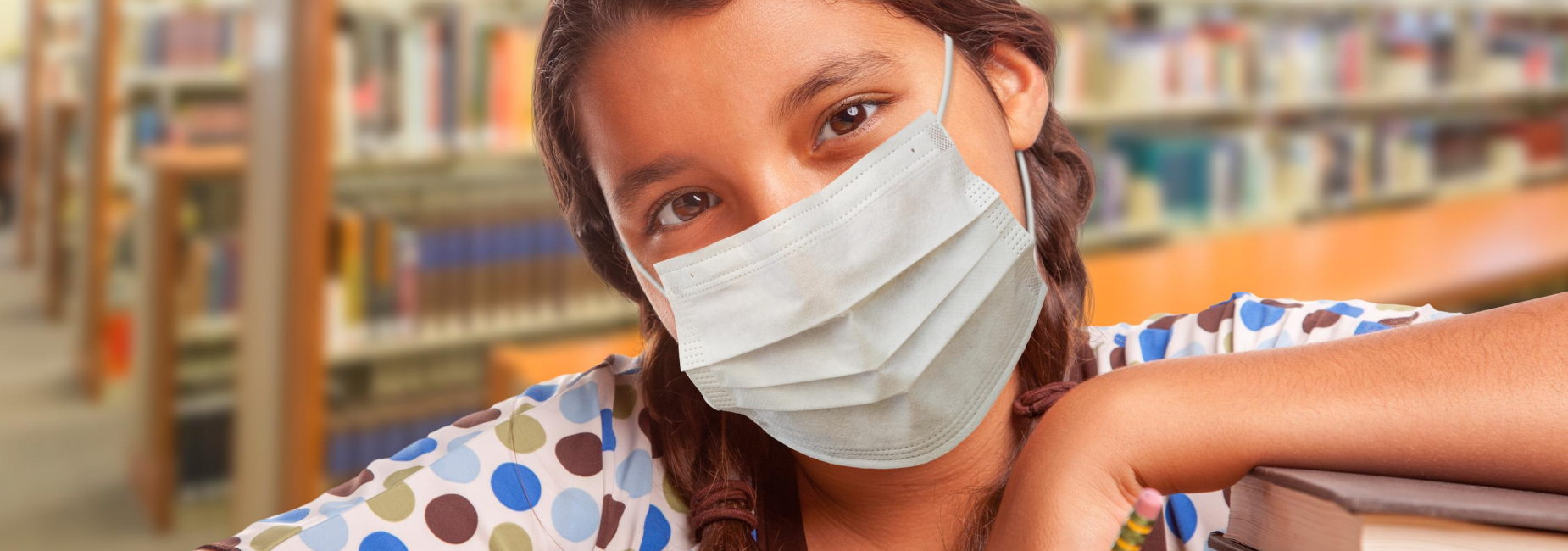 girl with braids wearing face mask