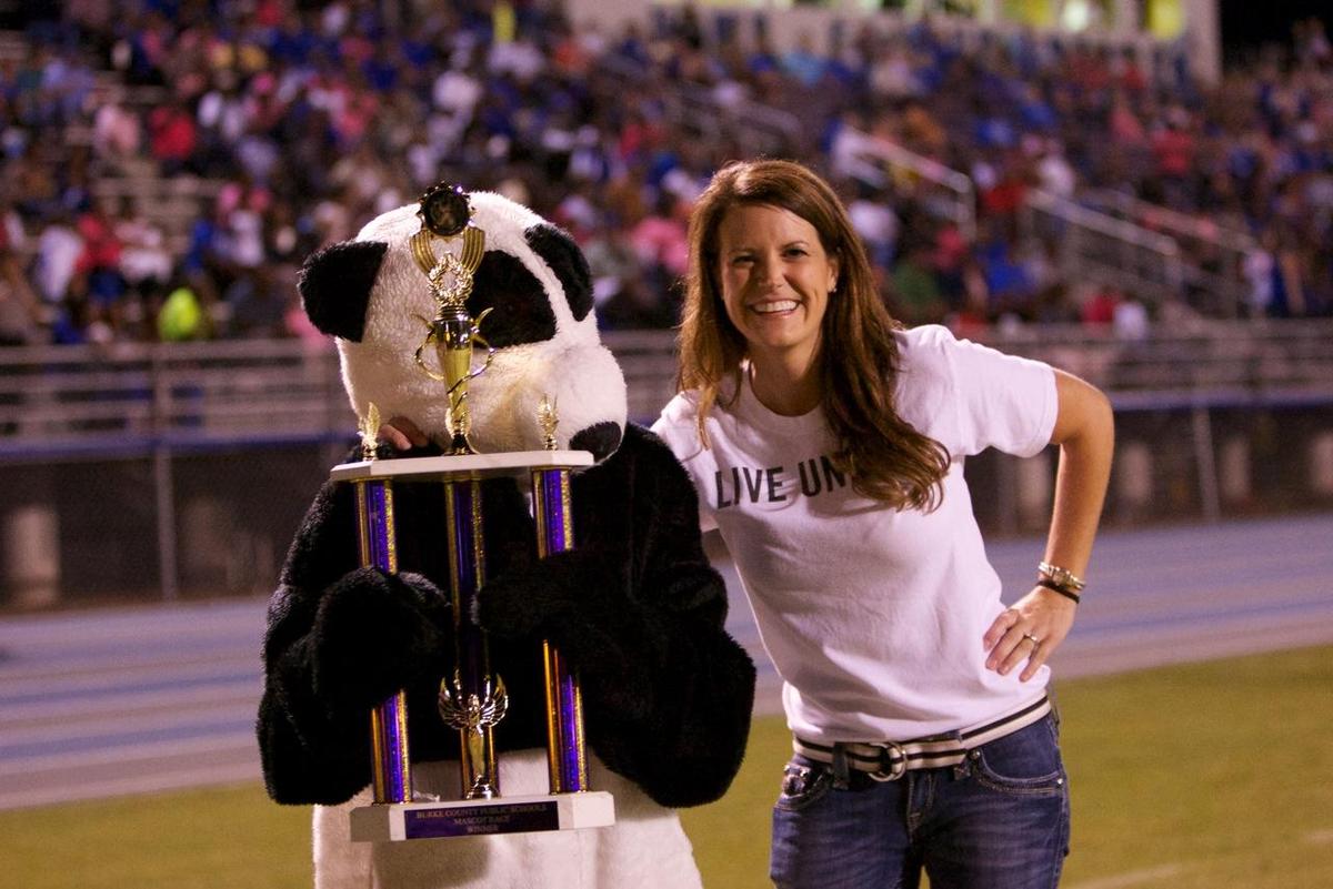 amy standing with panda mascot