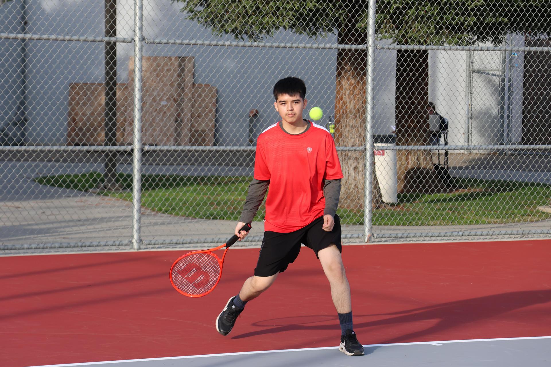 CUHS Boys playing tennis against coalinga