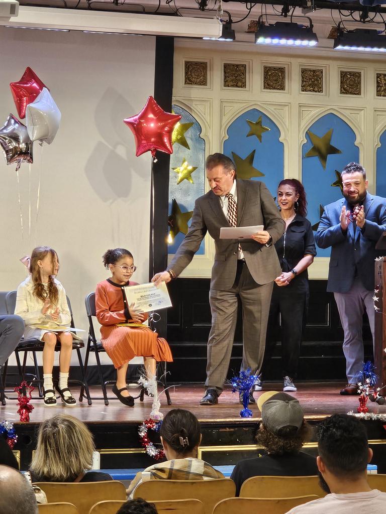 Student receiving their certificate