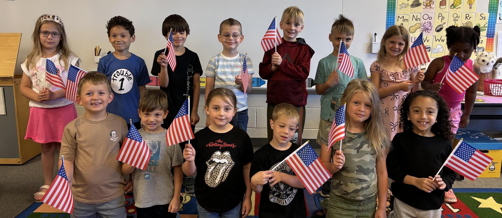 Students with small america flags
