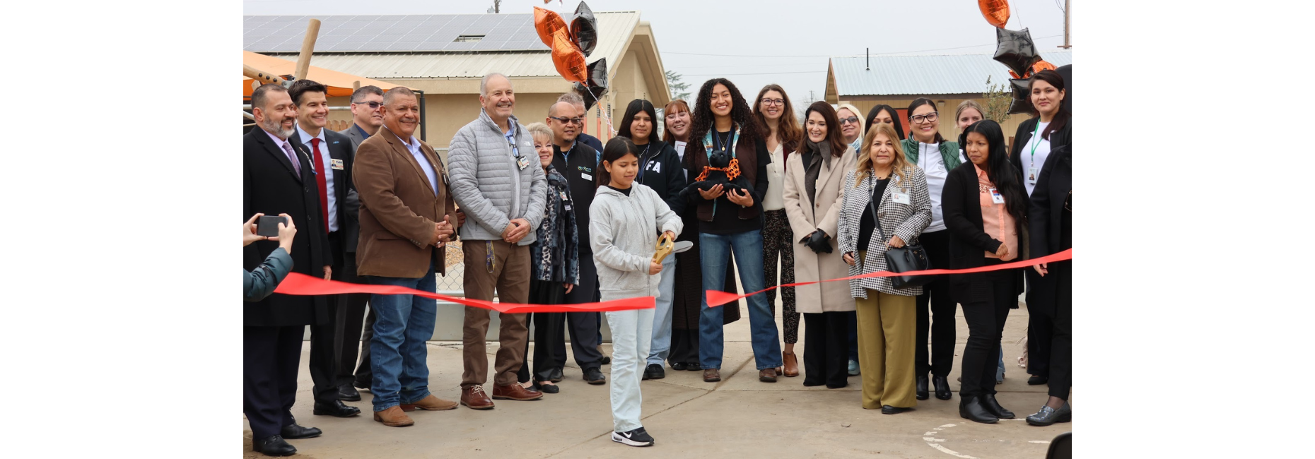 Green schoolyard ribbon cutting