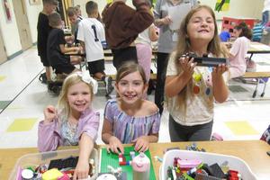 Eden and Isla Scott and Harper Shriver play with legos together
