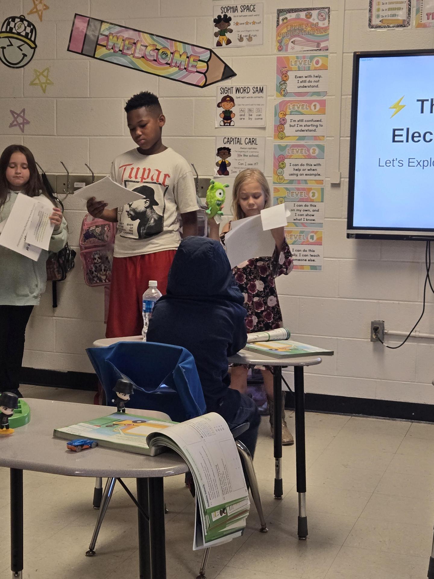uplift students presenting about electricity