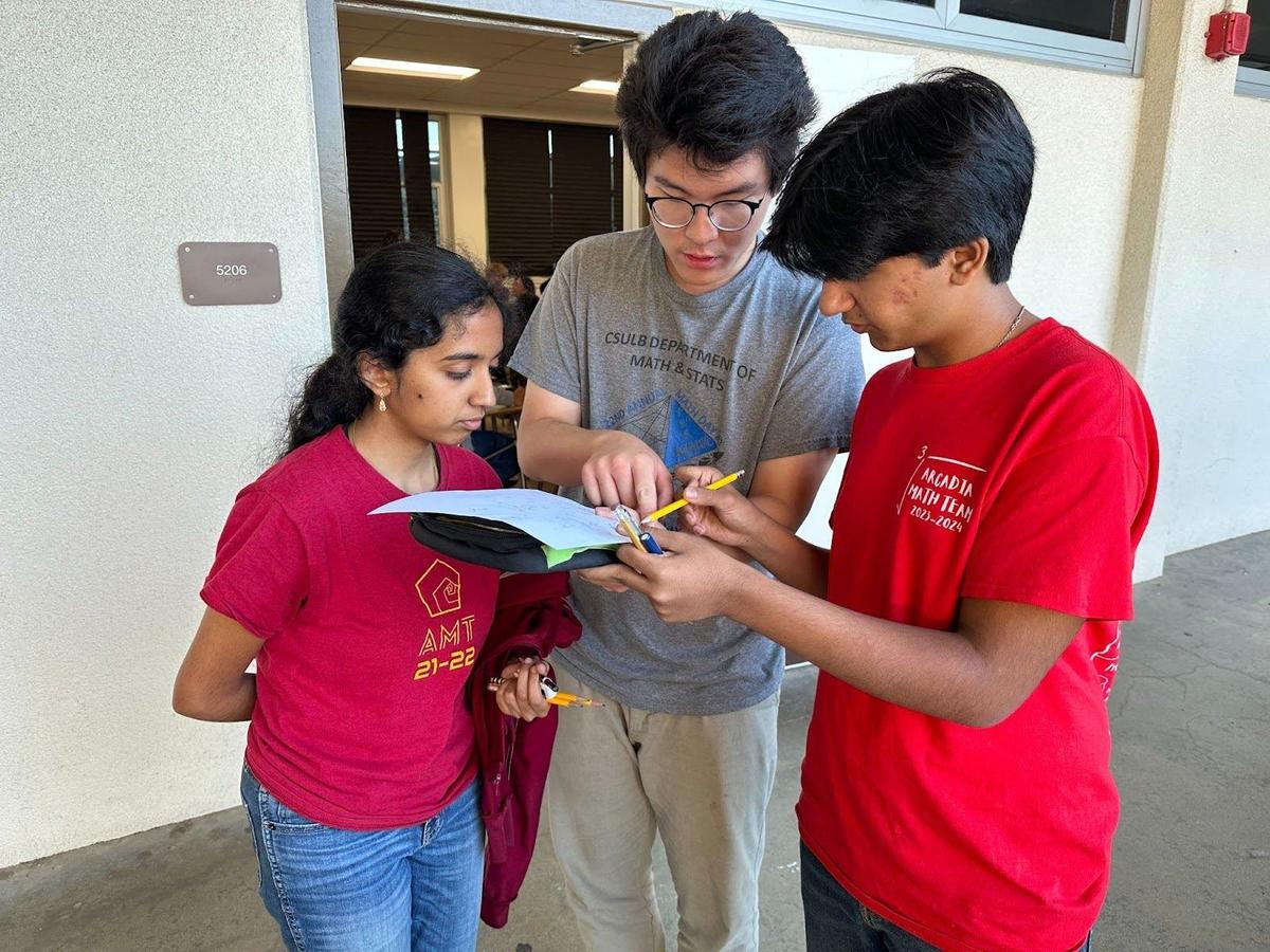 Huang guiding Math Team members at the Bay Math League (BML) Competition through the following question: limit sqrt(4x^2+3x)-2x when x approaches to negative infinity  