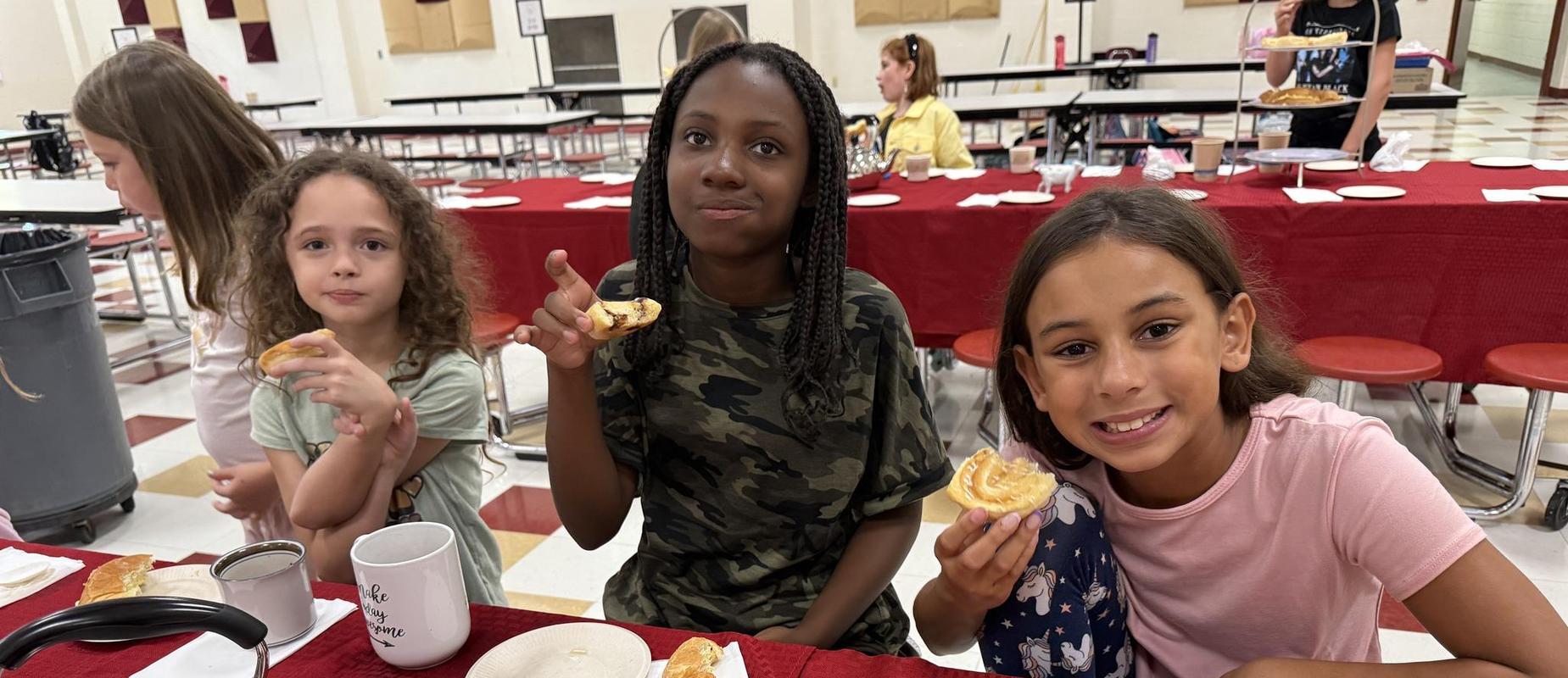 Girls Tea tasking goodies and socializing