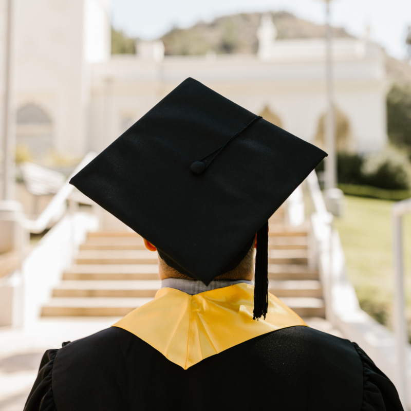 graduate looking out at school