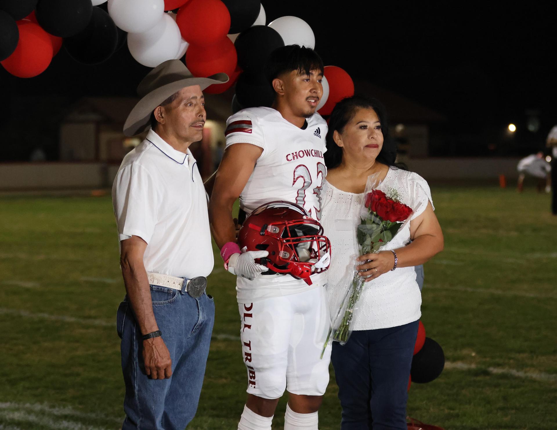 seniors and their escorts celebrating senior night