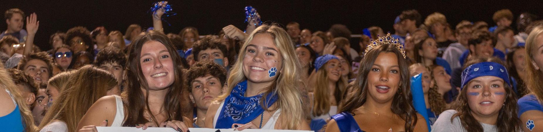 fans cheering at a football game