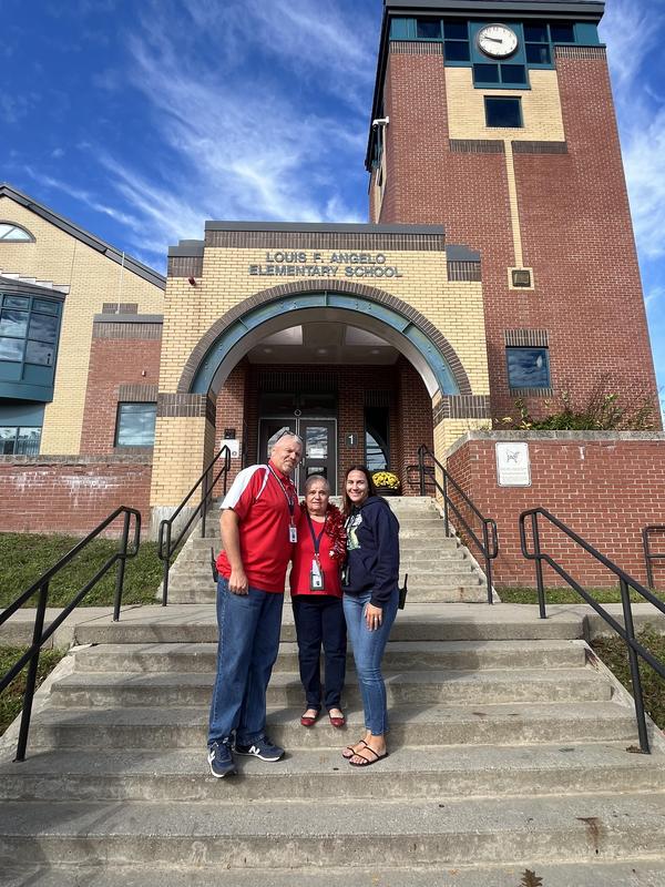 Manuela with members of the Angelo team on the front steps.