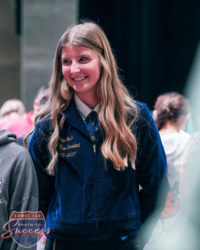 Davenport High School graduate Kate Nash presenting to students on behalf of Future Farmers of America