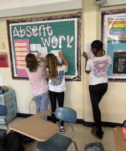 This team of students work together to break down a Spanish paragraph to learn new cultures.