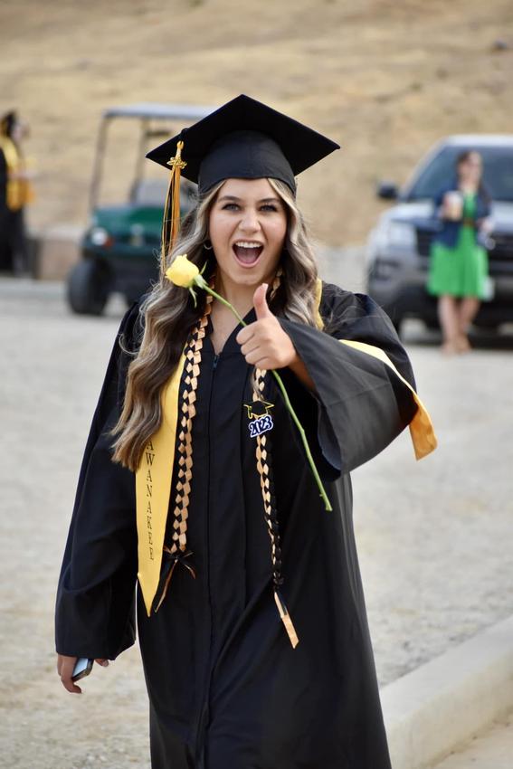 Student posing at graduation
