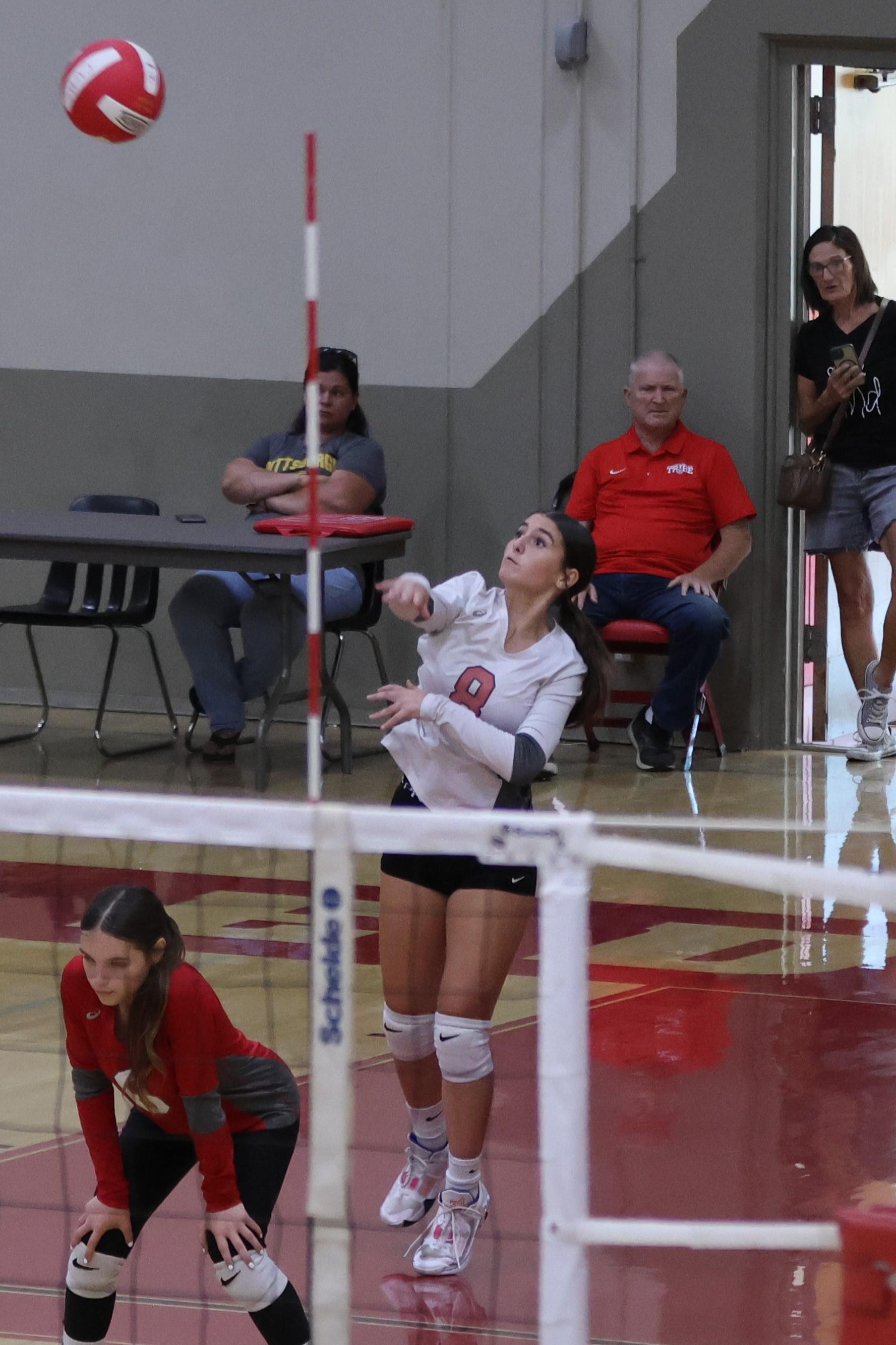 junior varsity girls playing volleyball 80