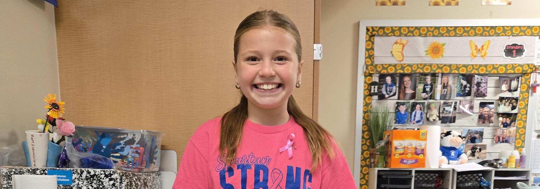 student wearing pink for breast cancer