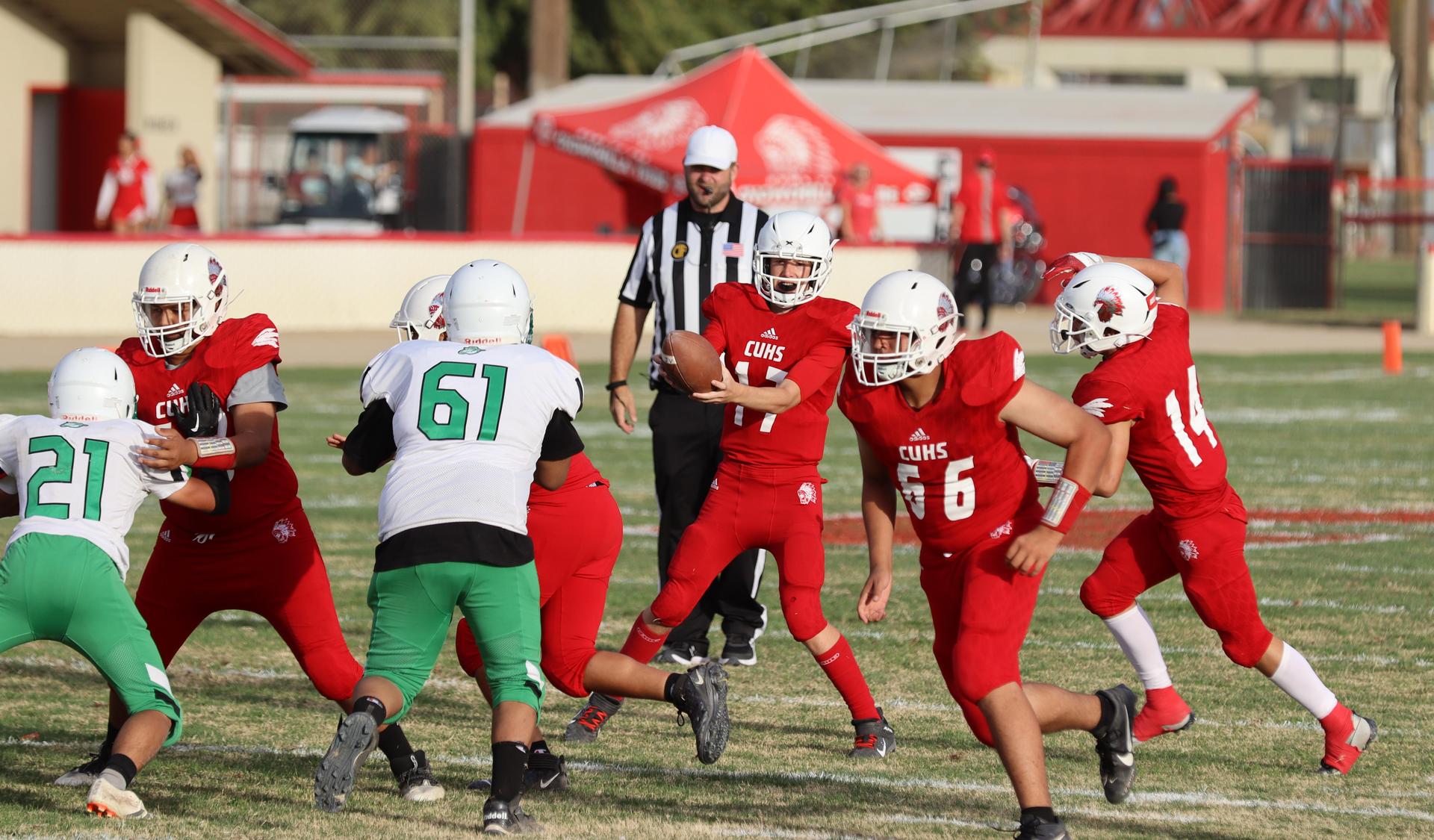  junior varsity football players in action against riverdale