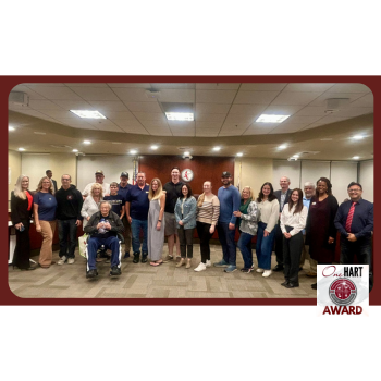 Photo of a large group of people in the boardroom
