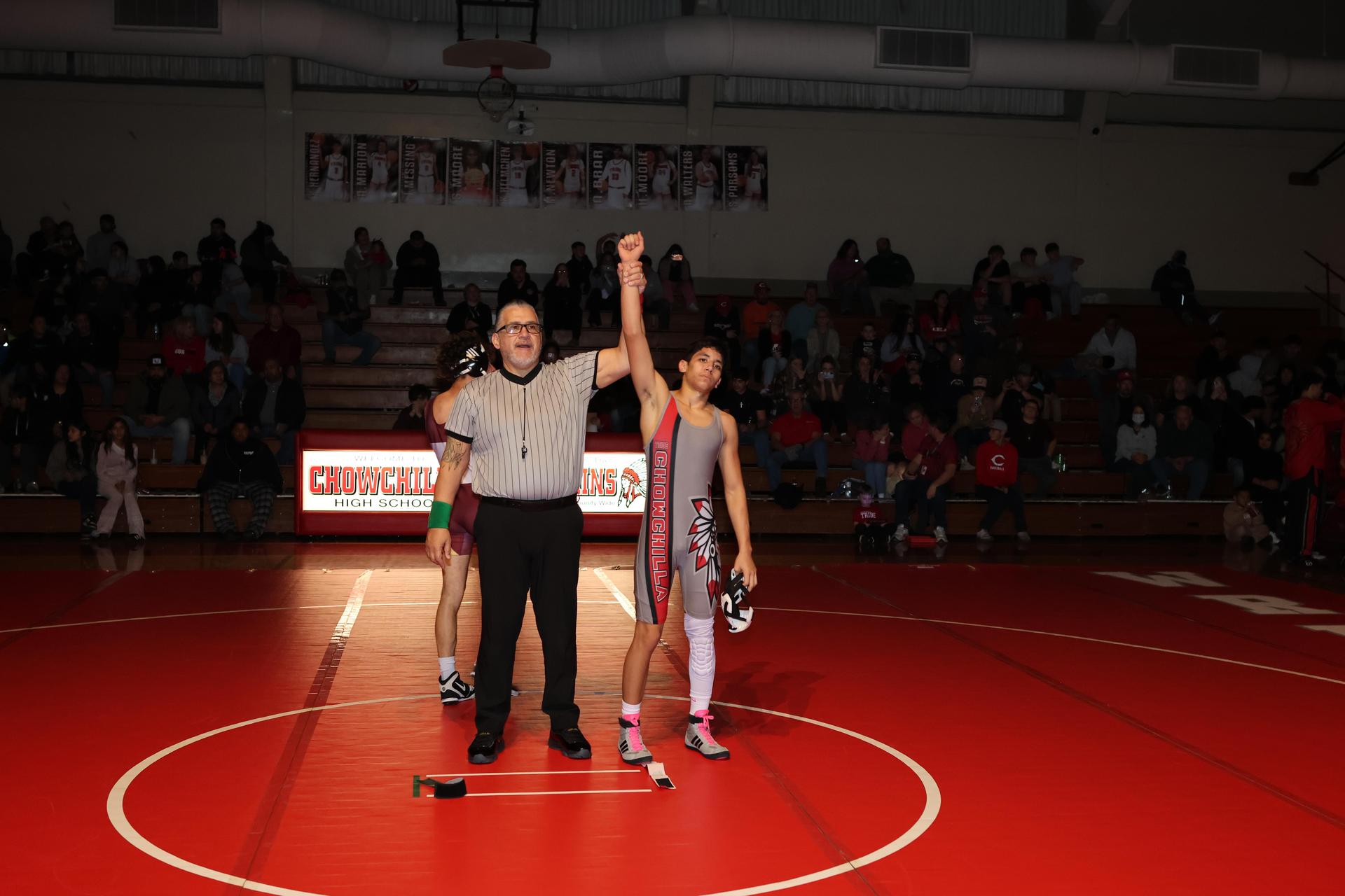 Wrestling winners with hands up 22