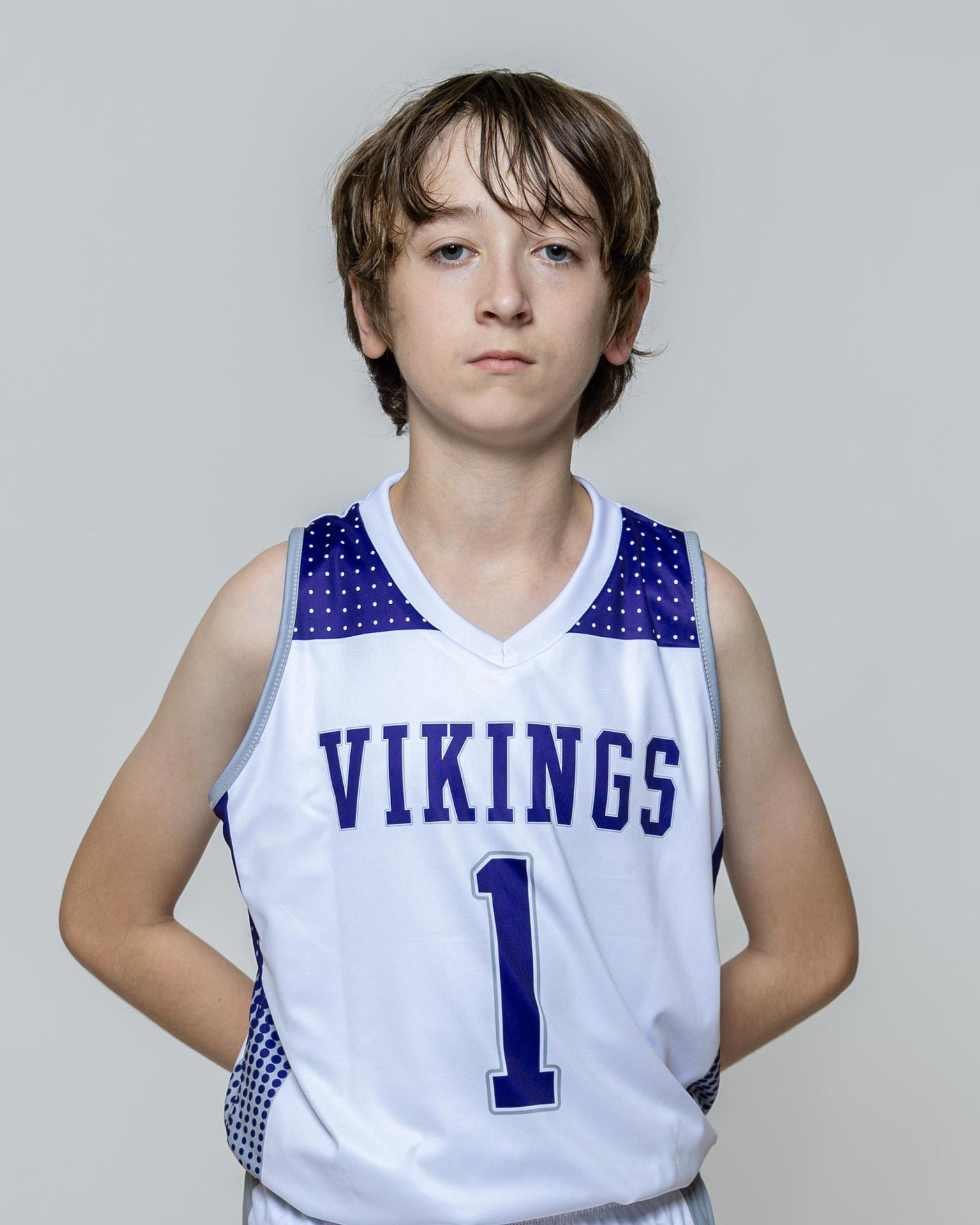 Male player number 1 posing with serious stature for a picture