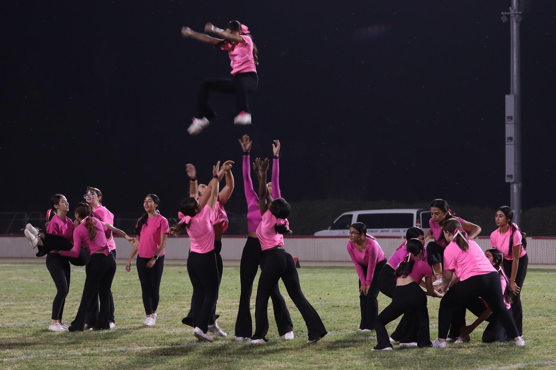 Varsity Cheer performing at halftime vs. Fowler