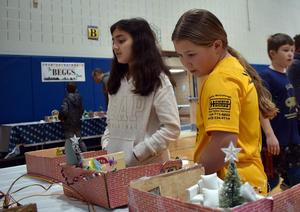 students looking at dioramas based on the movie Home Alone