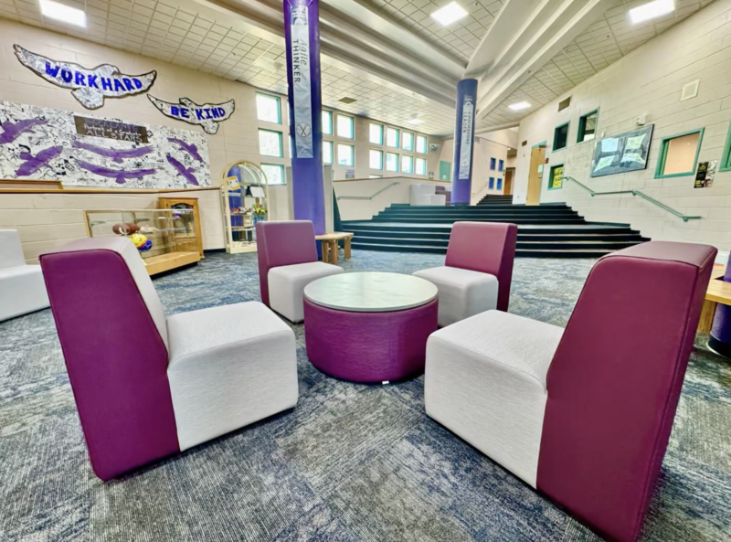 New, modern-style purple and gray furniture in the Commons Area of Escalante Middle School