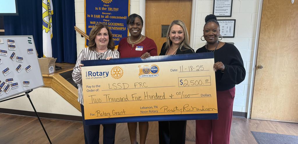 Large Check presented to 4 adults