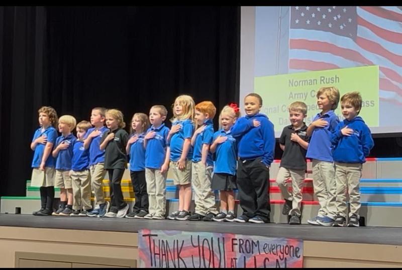 Students Singing on Stage at Veteran's Day Program