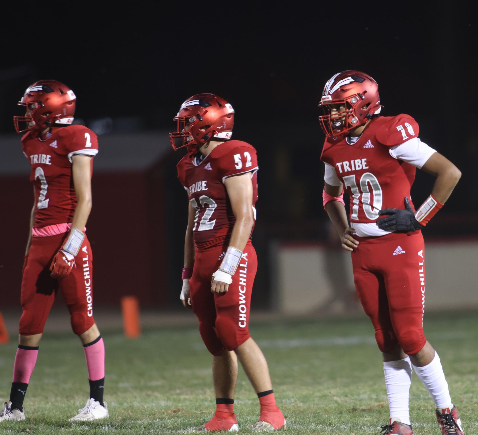 varsity boys playing football against Fowler