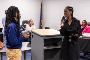 Xaiveyon presented with award by Sen. Costa representative