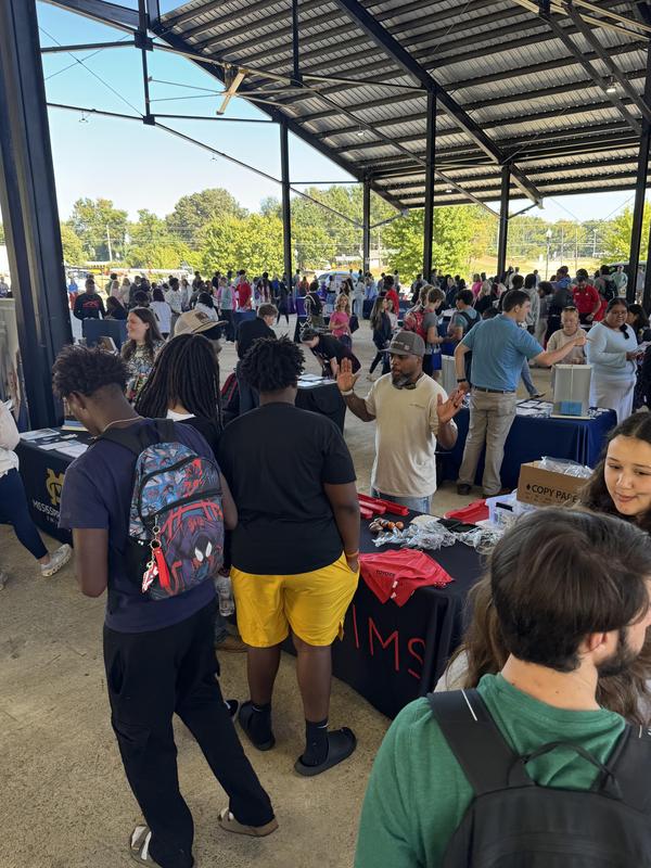 PHS students at the career fair, meeting with different people at tables