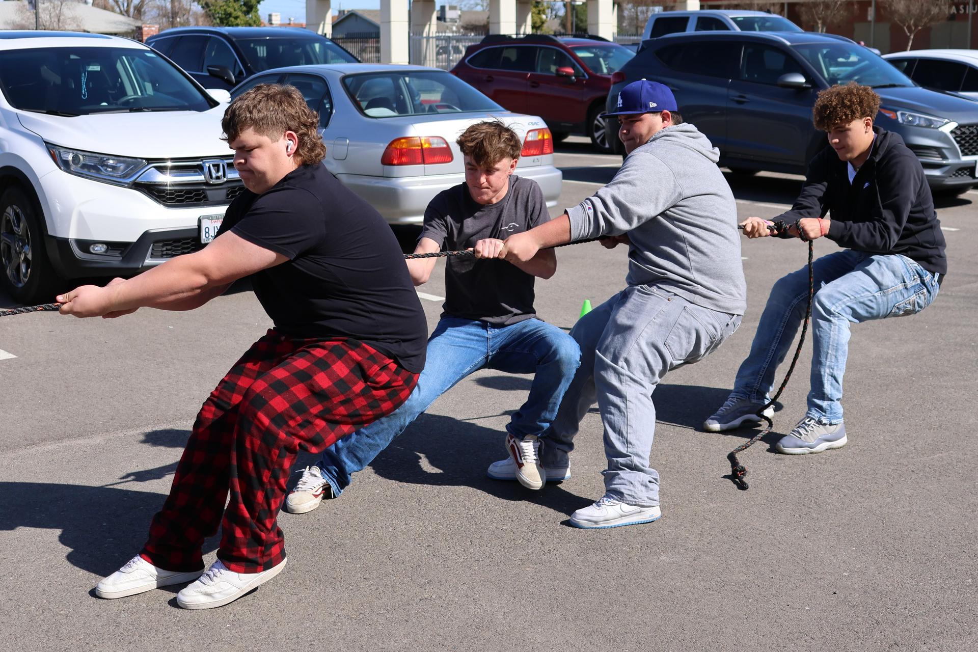 students and staff enjoying the truck pull