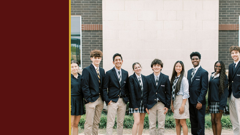 High school students in navy blazers stand together outside