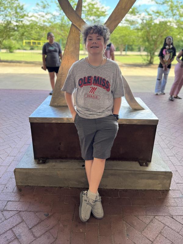 Max outside wearing an Ole Miss shirt