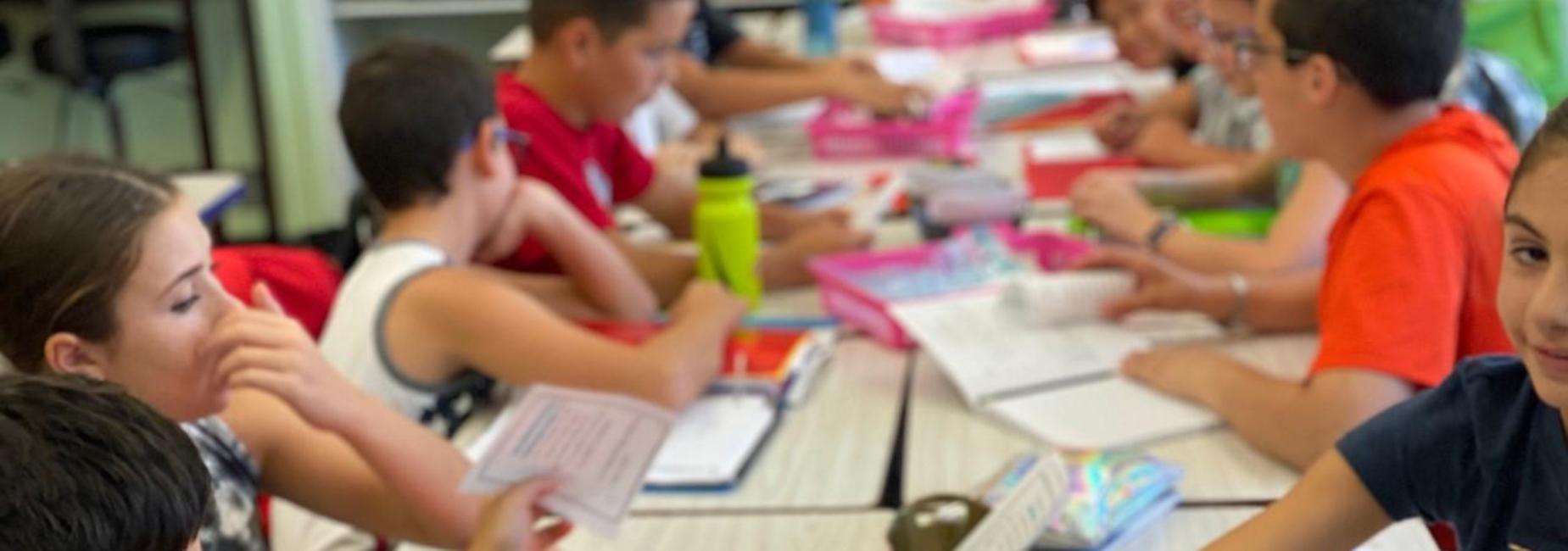 students at a table learning together