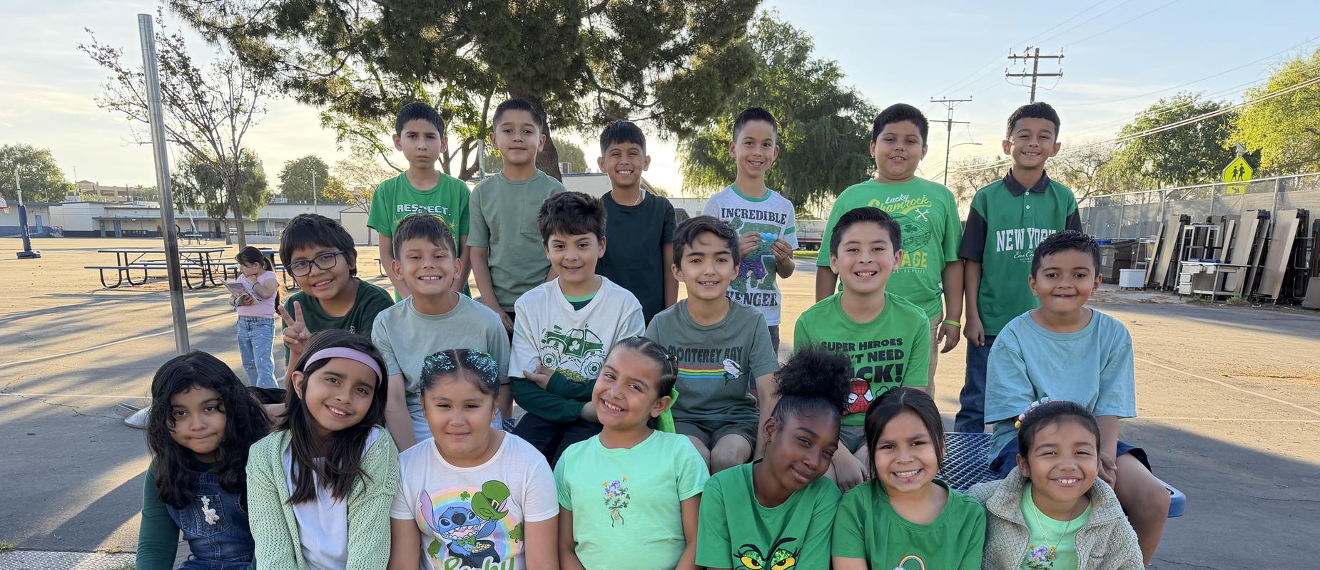 3rd Grade Class wearing green outfits.