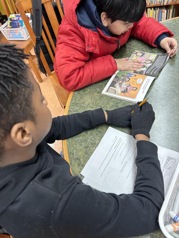 Students reading in the school library