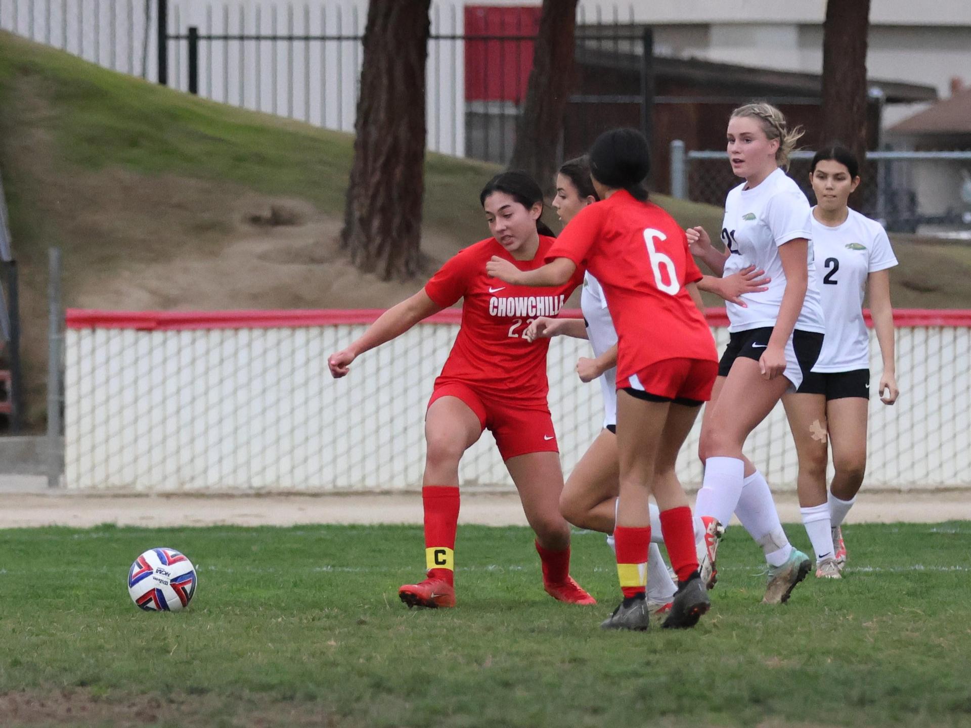 Junior varsity girls playing soccer against liberty