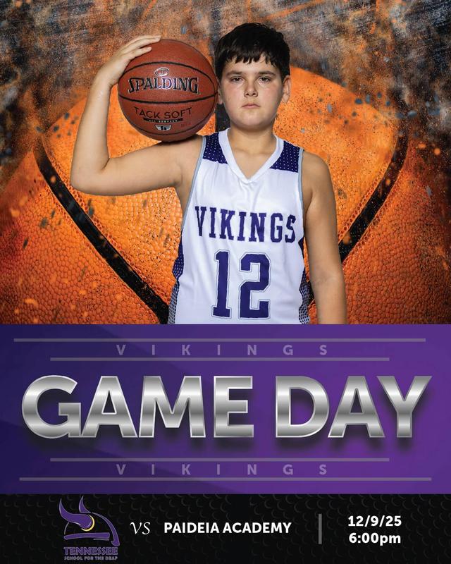 A basketball player holding a ball, wearing a Vikings jersey on game day.