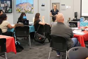Group of new teachers listening to a presentation
