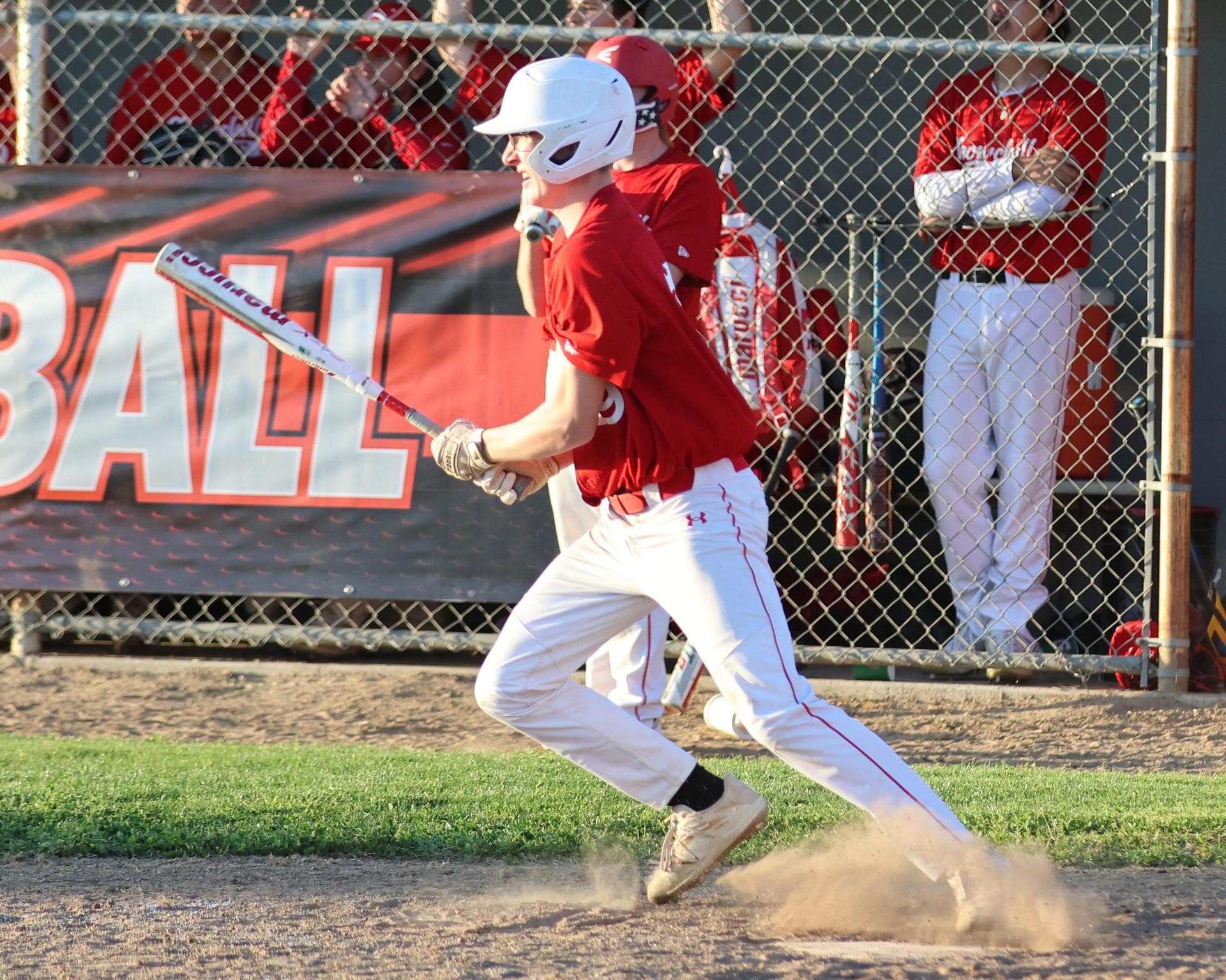 junior varsity baseball players in action