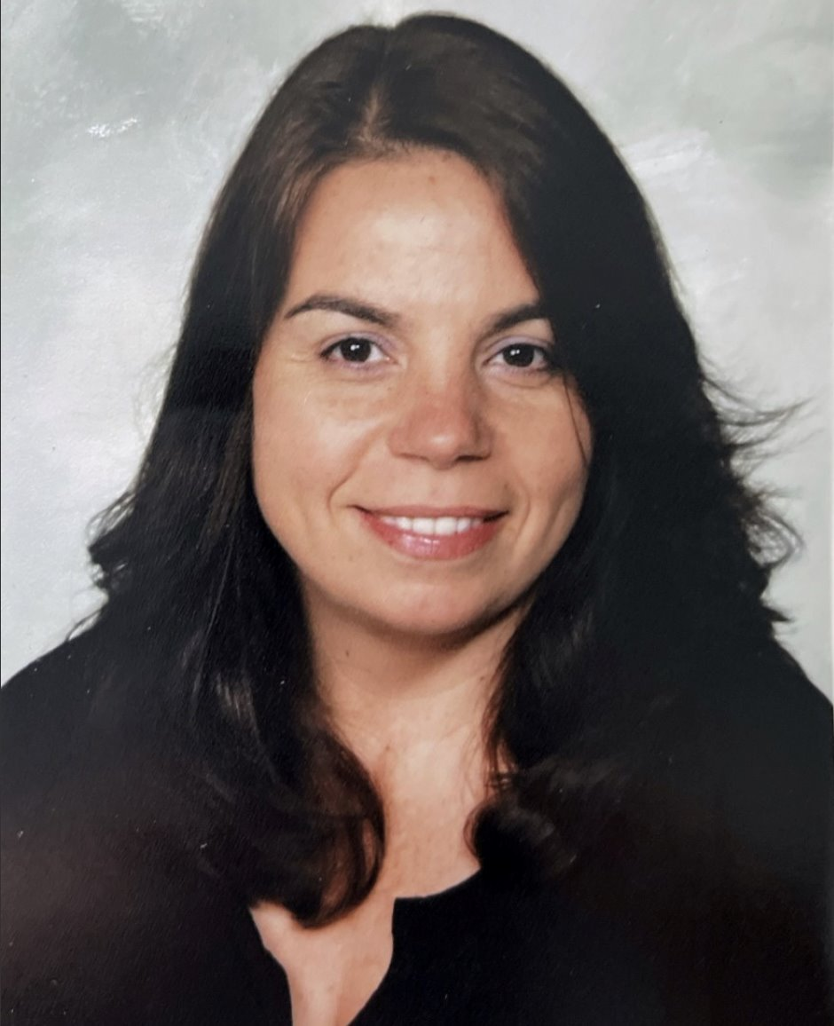 Female with long dark hair.  Image of Ms. Sanders