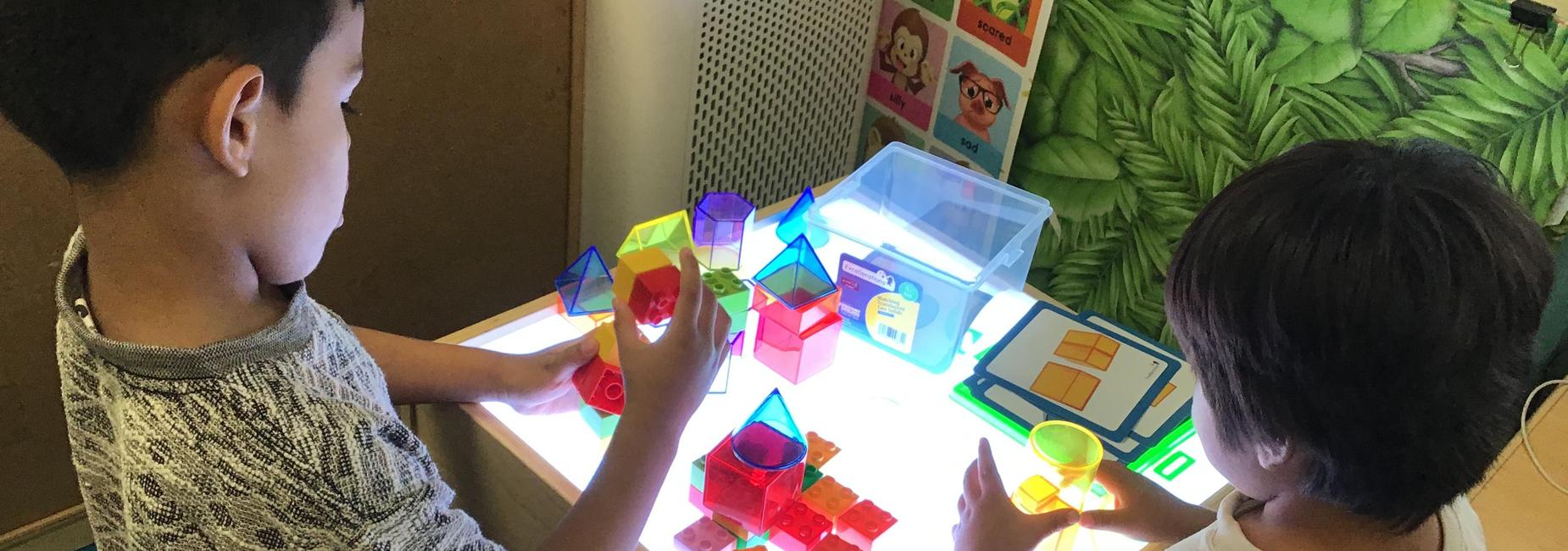Exploring colors, shapes, and patterns at the light table!