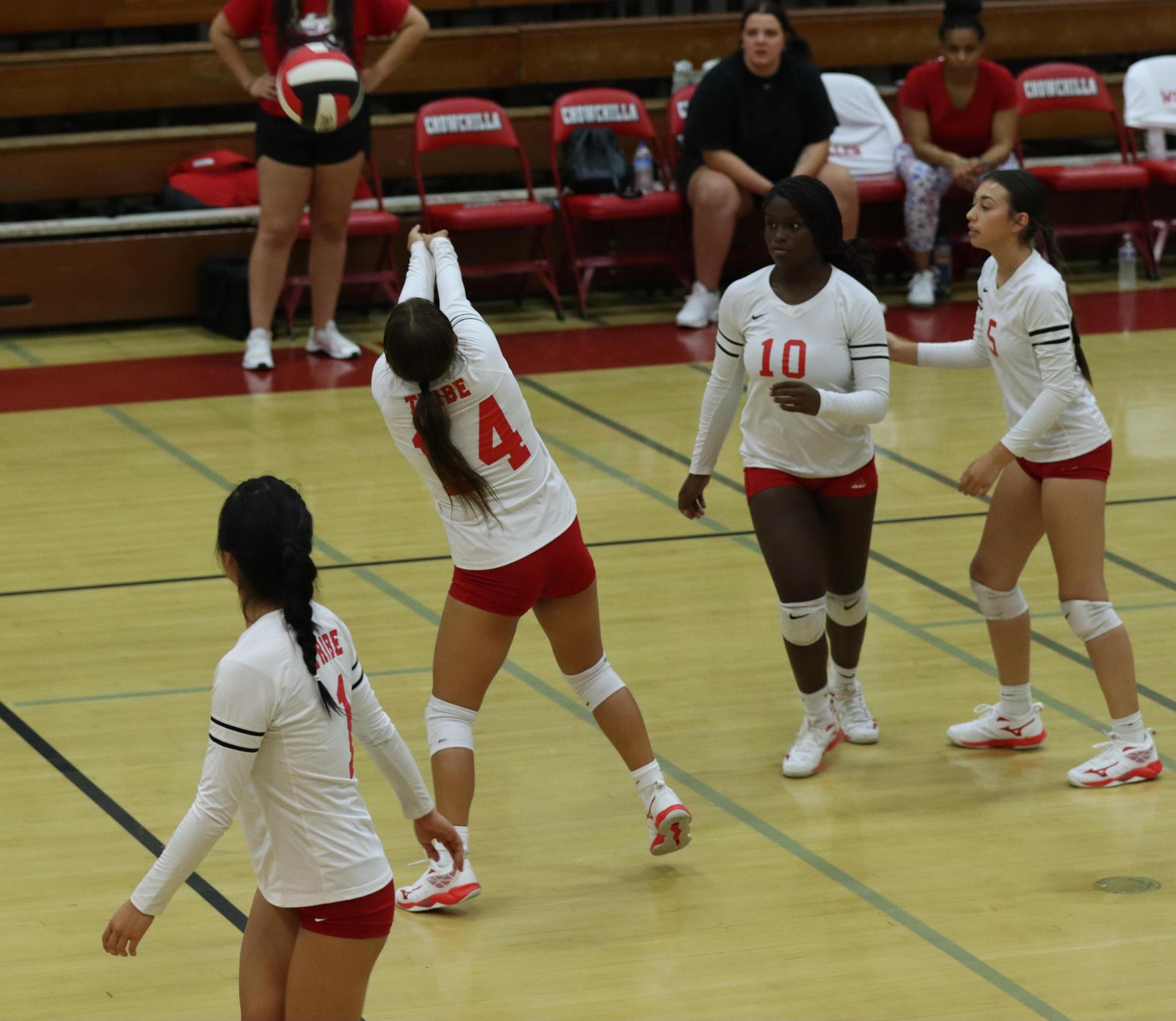 varsity volleyball players in action against golden valley
