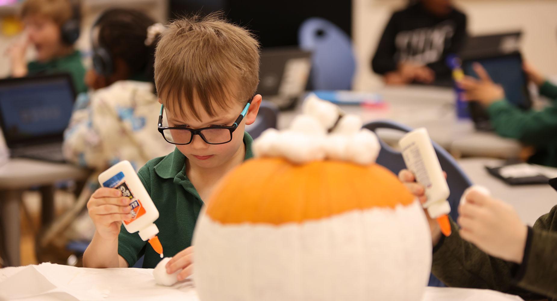 HSA Des Moines student working on an arts and crafts project