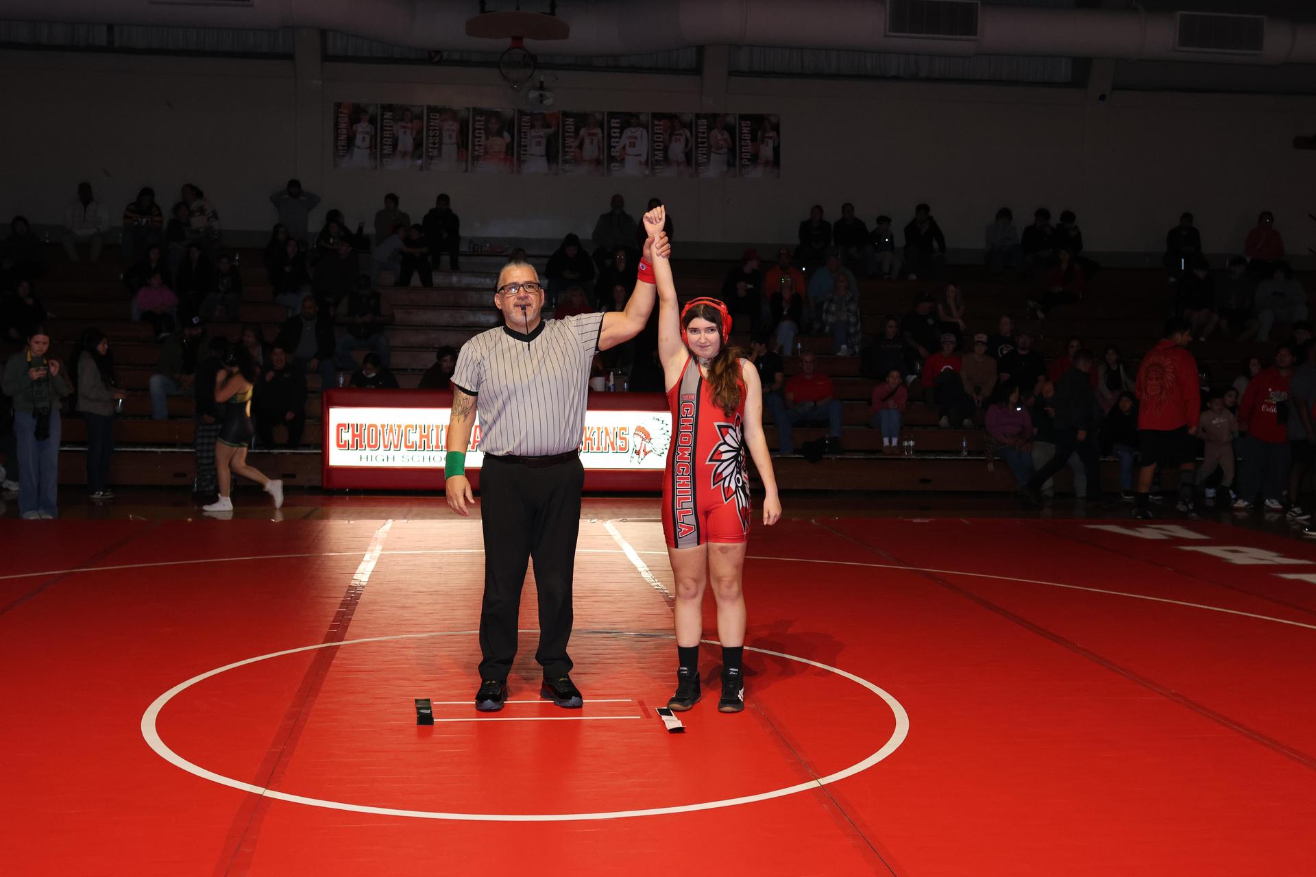 Wrestling winners with hands up 105
