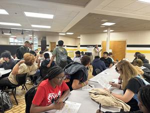 Seniors filling out registration forms