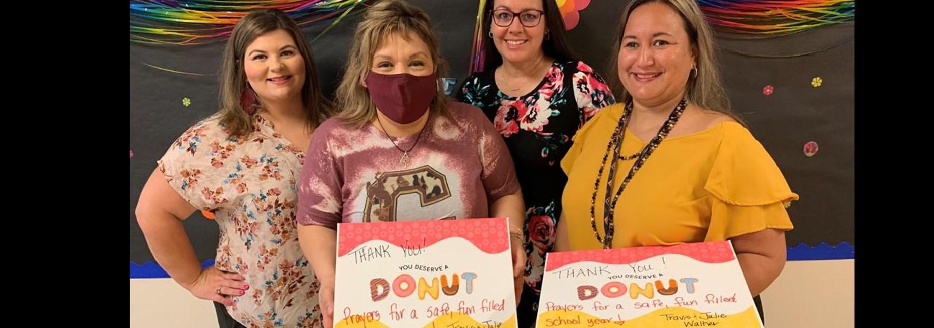 Teachers with donated donuts